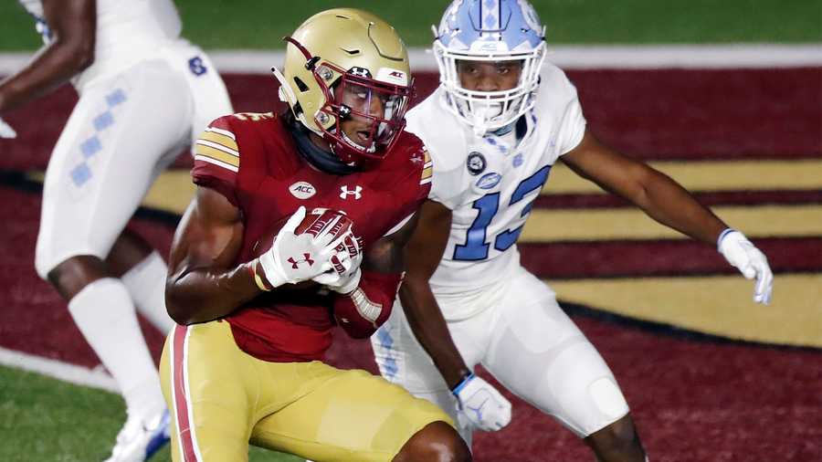 Boston College wide receiver CJ Lewis makes a touchdown reception against North Carolina defensive back Obi Egbuna (13) during the second half of an NCAA college football game, Saturday, Oct. 3, 2020, in Boston. (AP Photo/Michael Dwyer)
