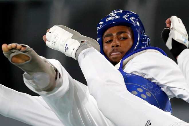 US&#x20;Carl&#x20;Nickolas&#x20;&#x28;L&#x29;&#x20;competes&#x20;against&#x20;Colombia&#x00B4;s&#x20;Miguel&#x20;Angel&#x20;Trejos&#x20;in&#x20;the&#x20;men&amp;apos&#x3B;s&#x20;Kyorugi&#x20;-80kg&#x20;final&#x20;taekwondo&#x20;event&#x20;of&#x20;the&#x20;Pan&#x20;American&#x20;Games&#x20;Santiago&#x20;2022,&#x20;at&#x20;the&#x20;Contact&#x20;Sports&#x20;Centre&#x20;of&#x20;the&#x20;National&#x20;Stadium&#x20;Sports&#x20;Park&#x20;in&#x20;Santiago&#x20;on&#x20;October&#x20;22,&#x20;2022.&#x20;&#x28;Photo&#x20;by&#x20;JAVIER&#x20;TORRES&#x20;&#x2F;&#x20;AFP&#x29;&#x20;&#x28;Photo&#x20;by&#x20;JAVIER&#x20;TORRES&#x2F;AFP&#x20;via&#x20;Getty&#x20;Images&#x29;