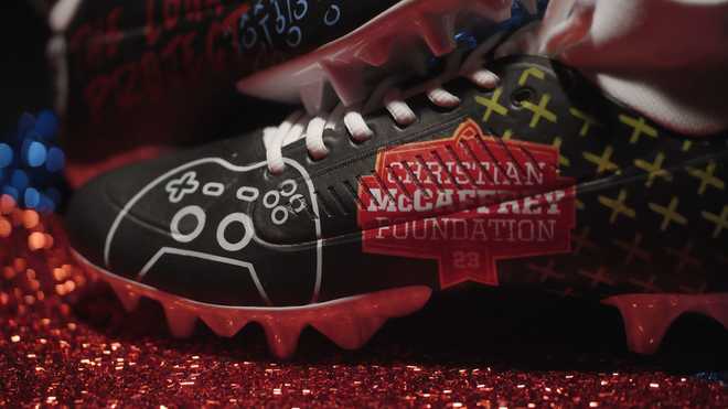 The cleats of Christian McCaffrey, of the San Francisco 49ers, are shown.
