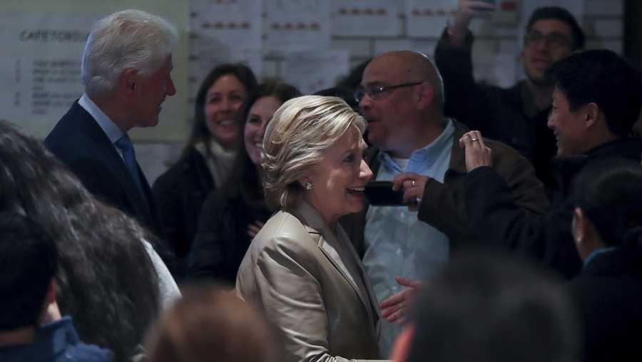Democratic presidential candidate Hillary Clinton, accompanied by her husband, former President Bill Clinton, arrives to vote at Douglas G. Grafflin School in Chappaqua, N.Y.