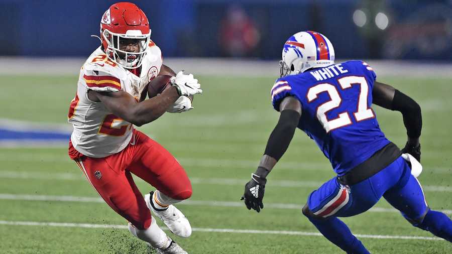 FILE - In this Monday, Oct. 19, 2020, file photo, Kansas City Chiefs running back Clyde Edwards-Helaire (25) runs the ball as Buffalo Bills cornerback Tre'Davious White (27) defends during the second half of an NFL football game, in Orchard Park, N.Y. There’s no shortage of high draft picks making huge impact around the league, especially on offense with the instant success of players like Edwards-Helaire. (AP Photo/Adrian Kraus, File)