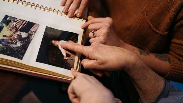 Maralee Hill and her daughter Victoria Hill look through old family albums in Wethersfield, Connecticut.