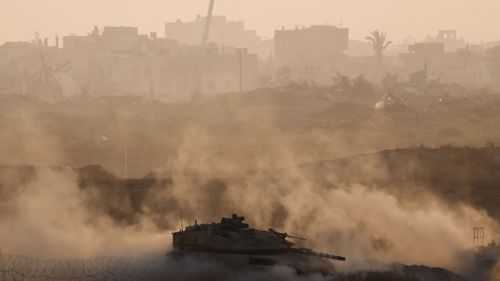 The US, Qatar and Egypt called on Israel and Hamas to resume talks in Cairo, and an Israeli tank is seen near the Israel-Gaza border, amid the conflict between Israel and Hamas on July 25.