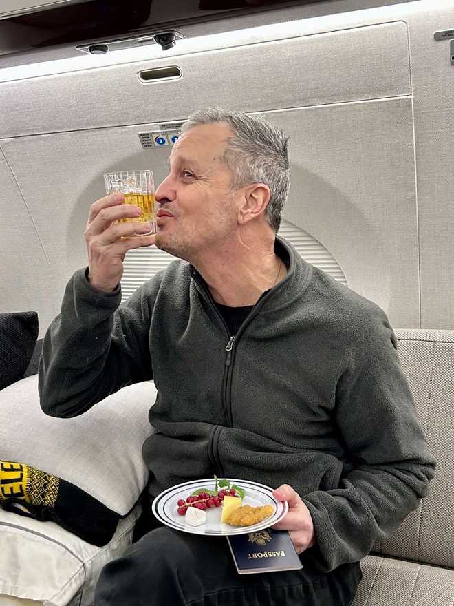 adam boehler shared a photo of marc fogel on a plane after being released by russia on february 11.