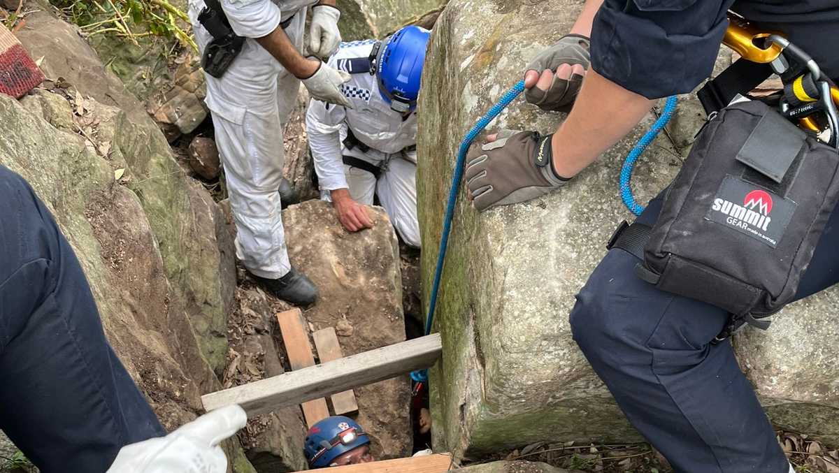Woman wedged upside down between rocks for 7 hours after trying to retrieve her phone