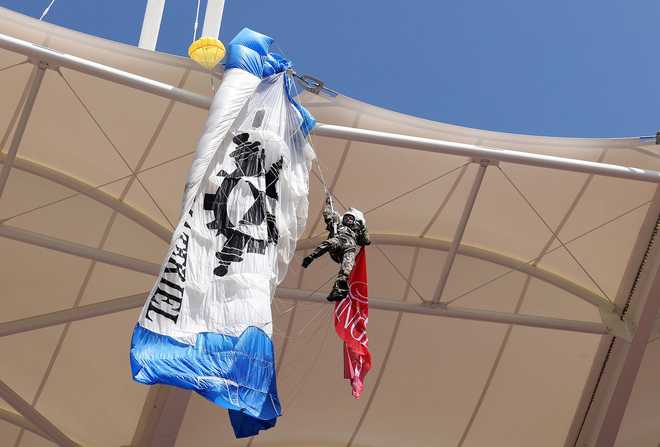 A&#x20;parachutist&#x20;became&#x20;snagged&#x20;on&#x20;the&#x20;roof&#x20;of&#x20;the&#x20;stadium&#x20;after&#x20;the&#x20;pre-match&#x20;ceremony&#x20;went&#x20;wrong.