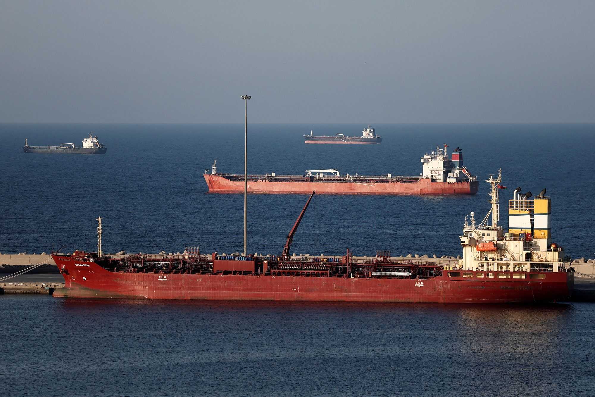 Iran begins laying mines in Strait of Hormuz, sources say
