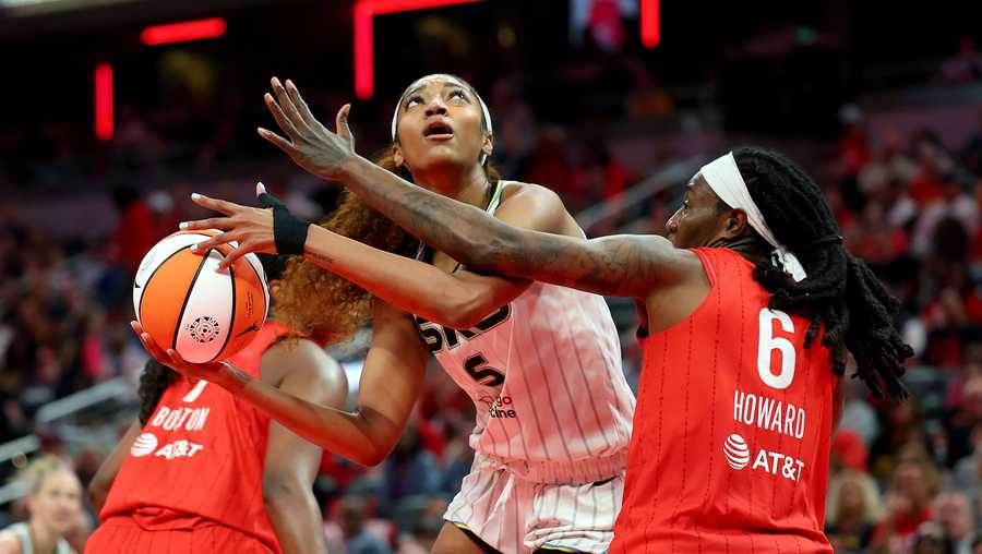 Angel Reese (center) had 12 points and 17 rebounds in the Chicago Sky's loss to the Indiana Fever on Saturday.