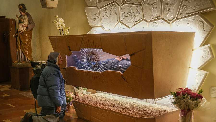 A nun prays at the tomb of Carlo Acutis in the Church of Santa Maria Maggiore in Assisi, Italy on March 18, 2025.