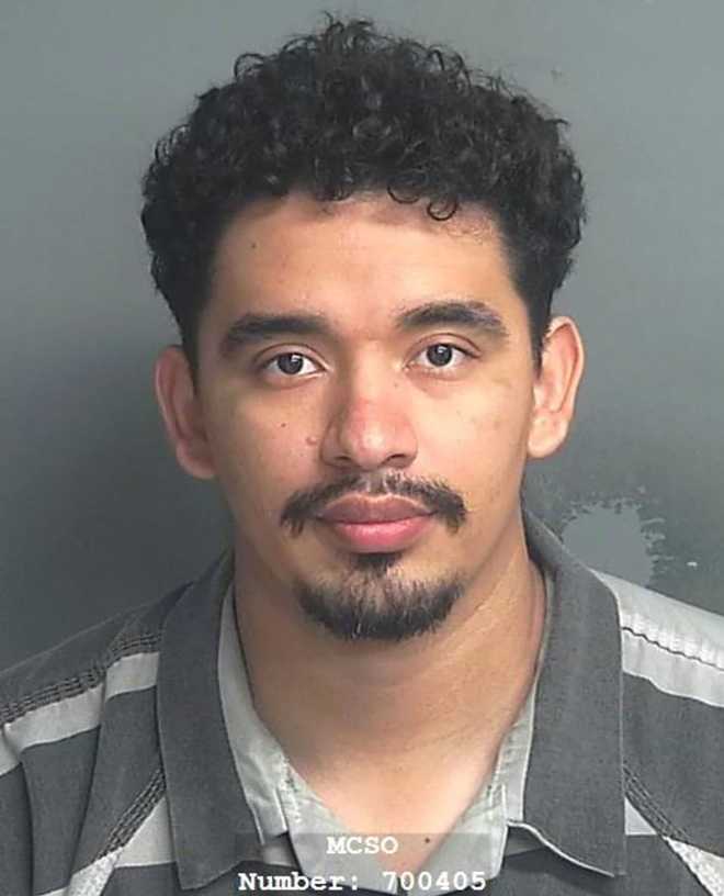 Giovanni Rosales Espinoza is seen in a booking photo