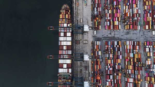 A ship and containers at the Port of Santos, in Santos, Brazil, are seen here in April. President Donald Trump signed executive actions on July 30, implementing a crippling 50% tariff on Brazil.
