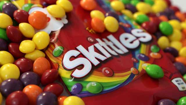 Skip to content ‘It's just PR': Skittles, Hershey and Nestle are removing artificial colors ‘It's just PR': Skittles, Hershey and Nestle are removing artificial colors Video Player is loading. / This is a modal window. Sorry, this video is not available, please check back later. Beginning of dialog window. Escape will cancel and close the window. Text Color Opacity Text Background Color Opacity Caption Area Background Color Opacity Font Size Text Edge Style Font Family End of dialog window. ✕ To make candies pop, sports drinks appear refreshing and chips look extra spicy. Many companies add synthetic dyes in our food. Some common examples include red number 40, yellow number 5, and blue number 2. I was just *** note. Nobody wants to eat petroleum. The FDA announced *** phasing out of petroleum-based synthetic food dyes from the nation's food supply. There's *** lot of controversy surrounding them and mainly because people are concerned about their potential toxicity. Maya Feller is *** nutritionist based in New York. She says artificial dyes are widespread, so we hit the grocery store to find out for ourselves. So this is our grocery store haul with some foods with artificial dyes in them and some of them you might have been able to guess, for example, sports drinks like this Blue Gatorade has Blue one in it. There are other things that you might not have guessed. This is smoked salmon along with fruit loops. Both of these have yellow 5, yellow 6, red 40, and blue 1. Kraft Heinz, Kellogg, PepsiCo and. General Mills are among some of the companies saying they're phasing out artificial dyes. So are these dyes safe? One study showed red number 3 caused cancer in male lab rats when exposed to high levels of the dye. It was previously banned from cosmetics in 1990. However, the FDA said humans aren't exposed to such high levels, and red number 3 is safe at the levels we currently consume them. And what the research says is that there's the potential for, right? Not that you're gonna have this food dye and you will have cancer. Some studies also suggest *** link between hyperactivity and children, though there is no conclusive evidence that artificial dyes cause ADHD. Feller says artificial dyes are typically in food that already contain *** high amount of added sugars, fats, and salts. Let's give folks options. Options should be lower in added sugar, lower in the saturated and synthetic fats and lower in the added salts. Ditching artificial dyes doesn't mean your food has to look lackluster. I mean. It smells like *** summer day. Taylor Ann Spencer works for *** Hearst Partners at Delish. She and her team have tested recipes using natural coloring options like freeze dried strawberries and cupcake frosting. They're *** great way to make anything pretty in pink. For savory dishes like this vegan queso, turmeric can give *** bright yellow hue. *** little goes along. Low here. Finally, and hear us out on this one purple cabbage. You extract the color by soaking it in boiling water. Depending on the pH of the drink, you'll get *** purple, blue, or pink color. And you can already see it's instantly pinky. And for any skeptics out there, our producers Lauren and Allie took *** taste test. Wait, I really can't tell. In May, the FDA approved three food colors from natural sources butterfly pea extract, which is derived from *** plant, Galdea extract blue, which is derived from algae, and calcium phosphate, which is *** mineral that can be used for white coloring. Reporting in Washington, I'm Amy Lou.