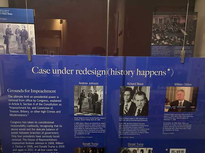 In September 2021, the Smithsonian placed a board over the exhibit, which read: “Case under redesign (history happens*)” and referenced Trump’s two impeachments.