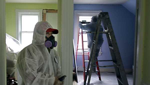 Contractors clean up lead paint at a contaminated building in Providence, Rhode Island. More than 30 million homes built before 1987 are estimated to have lead-based paint, the EPA says.