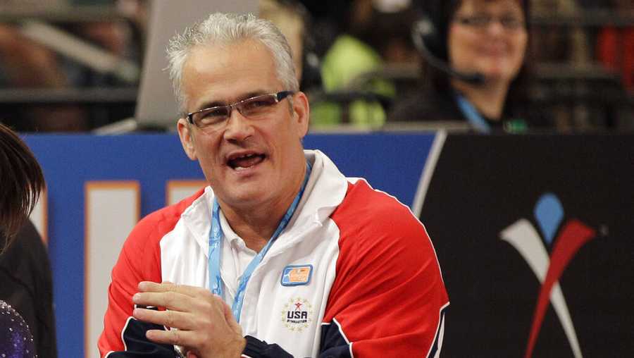 In this March 3, 2012, file photo, gymnastics coach John Geddert is seen at the American Cup gymnastics meet at Madison Square Garden in New York. Prosecutors in Michigan filed charges Thursday, Feb. 25, 2021, against Geddert, a former U.S. Olympics gymnastics coach with ties to disgraced sports doctor Larry Nassar. Geddert was head coach of the 2012 U.S. women's Olympic gymnastics team, which won a gold medal. (AP Photo/Kathy Willens, File)