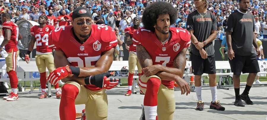 San Francisco 49ers safety Eric Reid (35) and quarterback Colin Kaepernick (7) kneel during the national anthem before an NFL football game against the Los Angeles Rams in Santa Clara, Calif., Monday, Sept. 12, 2016.