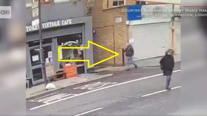 CCTV footage captured the moment when bricks fell from the top of a building during stormy winds in London, seconds after a pedestrian strolled past.