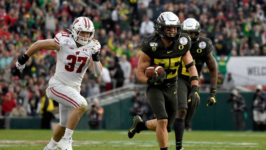 Brady Breeze #25 of the Oregon Ducks runs with the ball to score a 31 yard touchdown off of a recovered fumble on a punt by the Wisconsin Badgers during the third quarter in the Rose Bowl game presented by Northwestern Mutual at Rose Bowl on January 01, 2020 in Pasadena, California.