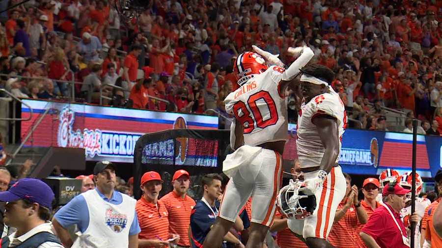 Clemson's Beaux Collins and KJ Henry celebrate following Collins' first-half touchdown.