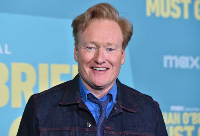 Conan O'Brien arrives at a photo call for "Conan O'Brien Must Go" in April 2024 in Los Angeles.