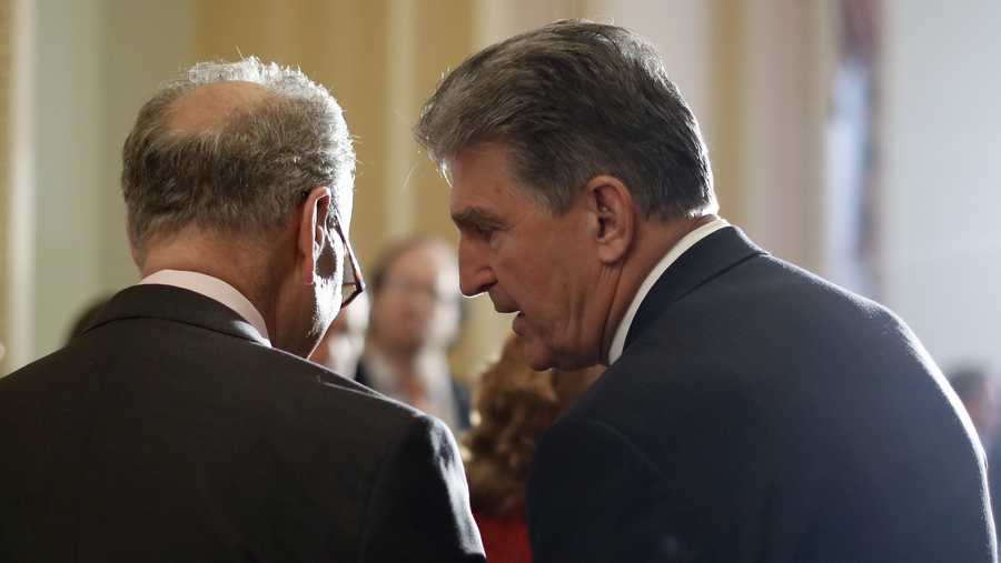 In this May 2, 2017, file photo, Sen. Joe Manchin, D-W.Va., right, speaks to then-Senate Minority Leader Charles Schumer, D-N.Y. during a news conference on Capitol Hill in Washington.