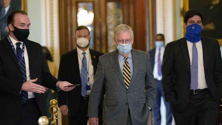 Senate Majority Leader Mitch McConnell of Ky., walks off of the Senate floor on Capitol Hill in Washington, Wednesday, Dec. 30, 2020.