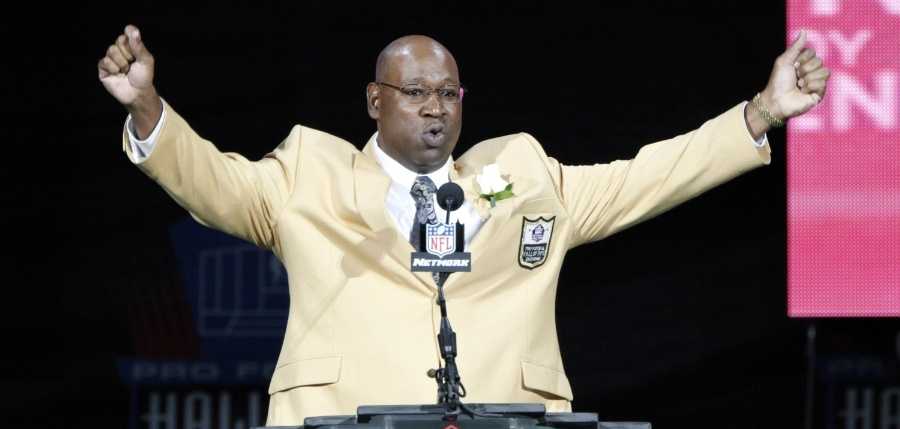 Former NFL player Cortez Kennedy gestures during his induction at the Pro Football Hall of Fame on Saturday, Aug. 4, 2012, in Canton, Ohio.