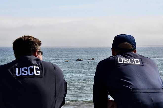 Crews retrieve sunken skid steer from Santa Cruz Wharf partial collapse