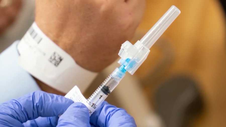 An image of a COVID-19 vaccine syringe