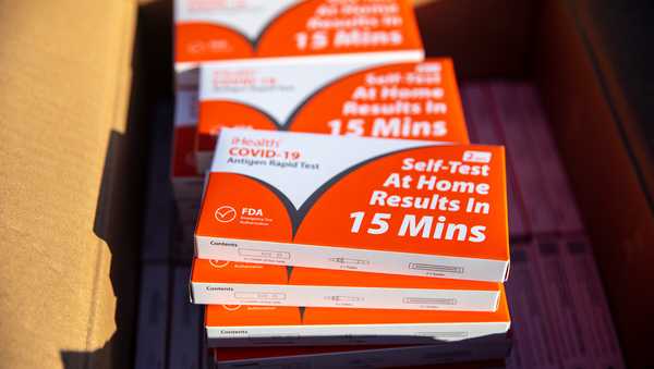 Redondo Beach, CA - January 06: Boxes of iHealth COVID-19 Antigen Rapid Test kits, provided by the state of California, are ready for parents to pick up, at Tulita Elementary School, as positive COVID-19 cases spike with the spread of the Omicron strain, in Redondo Beach, CA, Thursday, Jan. 6, 2022. (Jay L. Clendenin / Los Angeles Times via Getty Images)