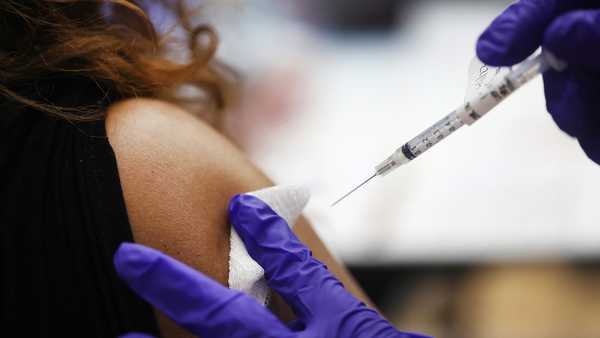 A nurse administers a second Covid-19 booster shot to a patient at Edward Hines Jr. VA Hospital on April 01, 2022 in Hines, Illinois.