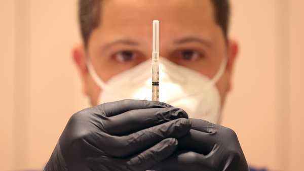 SAN RAFAEL, CALIFORNIA - APRIL 06: Jatniel Hernandez fills syringes with COID-19 vaccine booster shots at a COVID-19 vaccination clinic on April 06, 2022 in San Rafael, California. The U.S. Food and Drug Administration has authorized a second COVID-19 booster of Pfizer-BioNTech and Moderna vaccines for people over 50 years old four months after their first booster. (Photo by Justin Sullivan/Getty Images)