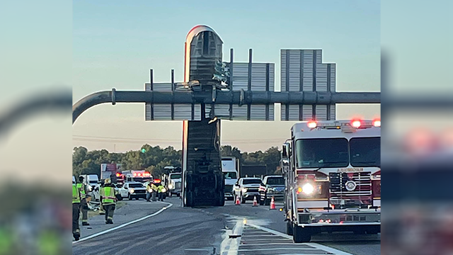 Ardmore crash leaves trailer vertically stuck against I-35 sign - KOCO
