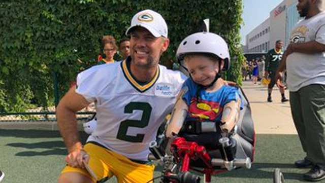 Titletown tradition: Packers bike to training camp