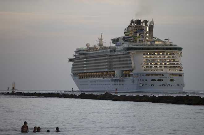 The Royal Caribbean Freedom of the Seas gets underway through the Government Cut shipping channel at PortMiami during the first U.S. trial cruise testing COVID-19 protocols on June 20, 2021 in Miami, Florida.