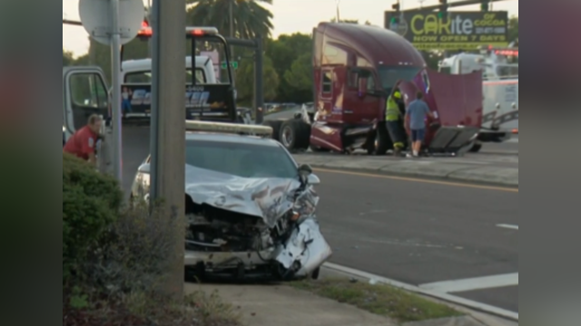 Cocoa crash involving police cruiser, tractor-trailer