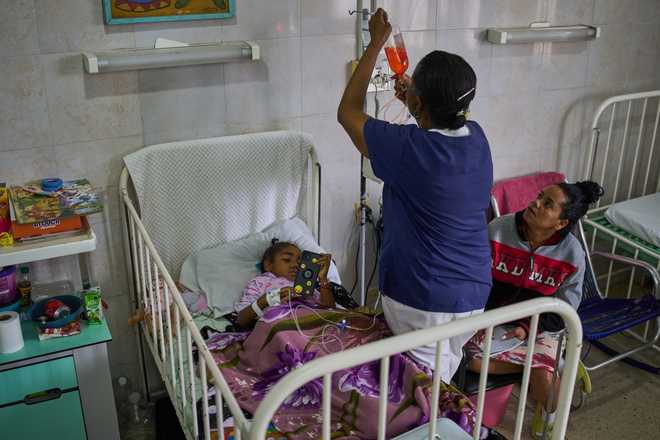 Carolina Silva Matos, a cancer patient, rests in a hospital bed at the National Institute of Oncology and Radiology in Havana, Cuba, Friday, Feb. 20, 2026.