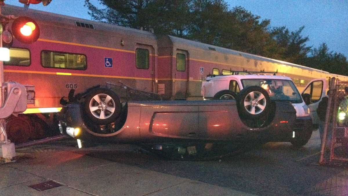 car parked on train tracks