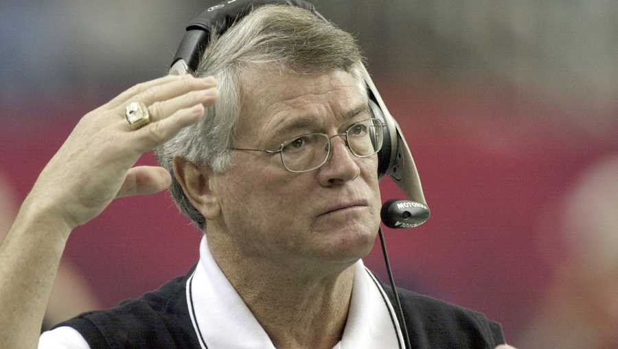 FILE - Atlanta Falcons coach Dan Reeves adjusts his headset at the start of play against the Detroit Lions at the Georgia Dome in Atlanta Sunday, Dec. 22, 2002.