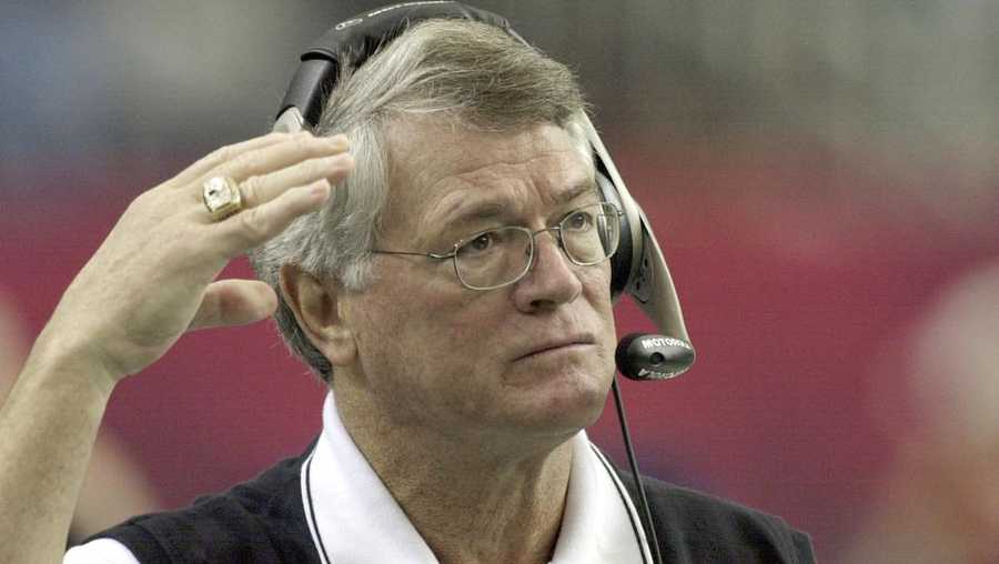 Atlanta Falcons coach Dan Reeves adjusts his headset at the start of play against the Detroit Lions at the Georgia Dome in Atlanta Sunday, Dec. 22, 2002.