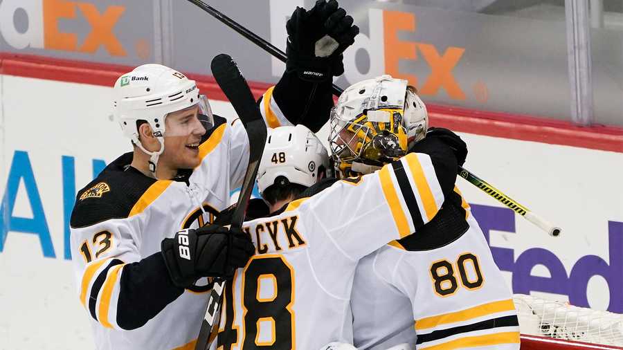 Trent Frederic of the Boston Bruins celebrates after scoring