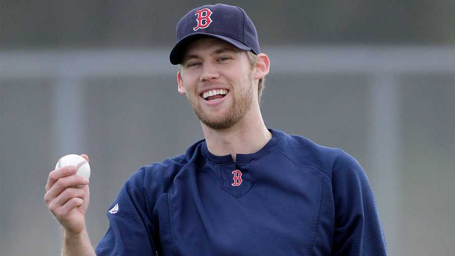 Boston Red Sox pitcher Daniel Bard grins during a warmup at the Red Sox training facility in Fort Myers, Fla., Saturday, Feb. 12, 2011. (AP Photo/Dave Martin)