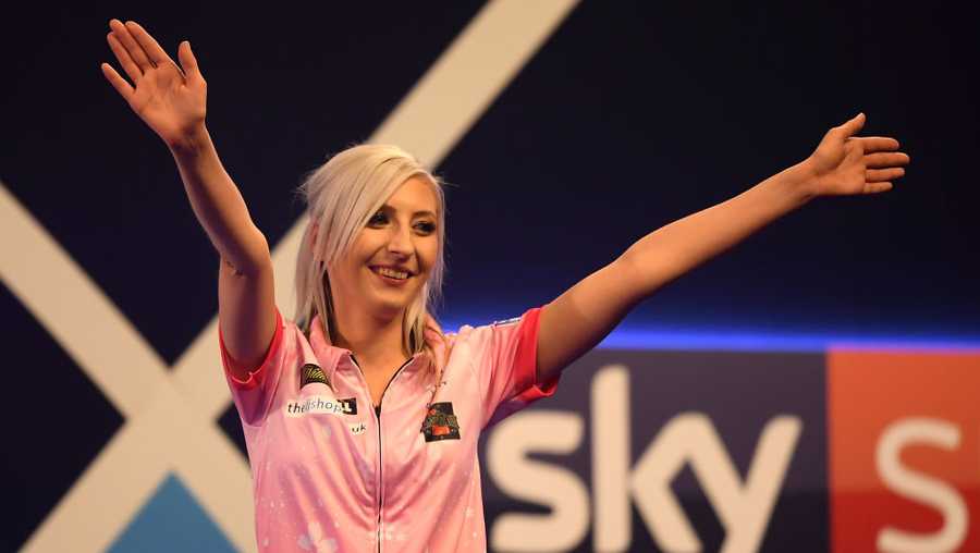LONDON, ENGLAND - DECEMBER 17:  Fallon Sherrock acknowledges the fans  after winning her 1st round game against Ted Evetts to become the first female to win a game in the PDC World Championships during Day 5 of the 2020 William Hill Darts Championship  at Alexandra Palace on December 17, 2019 in London, England.