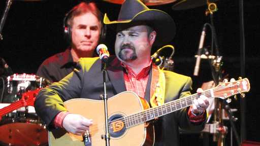 In this Nov. 22, 2013 file photo, Daryle Singletary performs at a tribute to George Jones in Nashville, Tenn. Singletary, who sang songs like "I Let Her Lie" and "Too Much Fun," died Monday, Feb. 12, 2018, at his home in Lebanon, Tenn. He was 46.