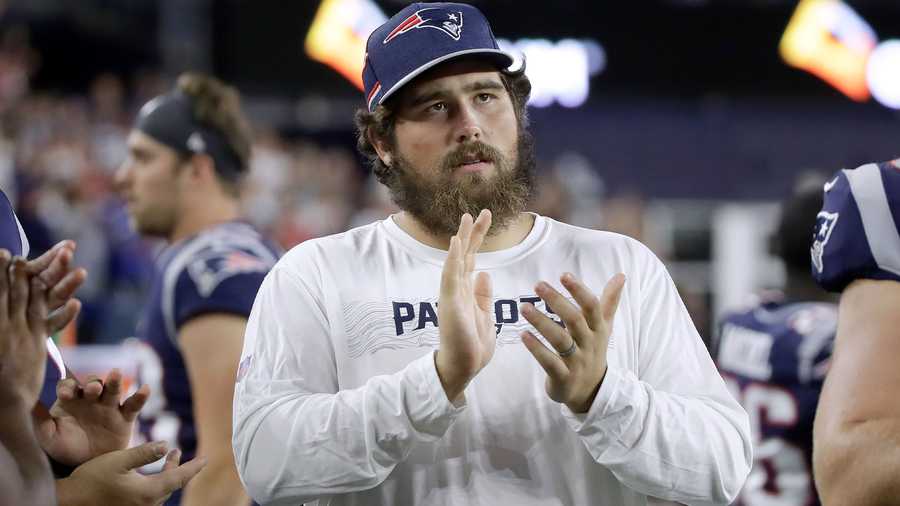 New England Patriots center David Andrews watches from the sideline in the second half of an NFL preseason football game against the New York Giants, Thursday, Aug. 29, 2019, in Foxborough, Mass. (AP Photo/Elise Amendola)