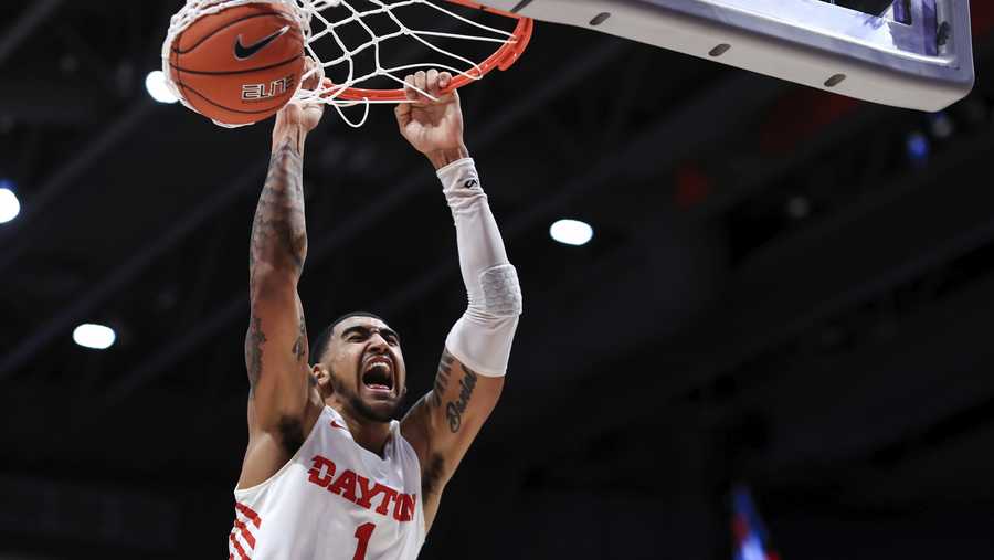 Dayton's Obi Toppin (1) reacts as he dunks the ball in the second half of an NCAA college basketball game against Duquesne, Saturday, Feb. 22, 2020, in Dayton, Ohio.  (AP Photo/Aaron Doster)