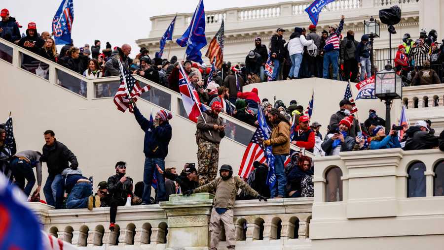 WASHINGTON, DC - JANUARY 06: Pro-Trump supporters storm the U.S. Capitol following a rally with President Donald Trump on January 6, 2021 in Washington, DC. Trump supporters gathered in the nation&apos;s capital today to protest the ratification of President-elect Joe Biden&apos;s Electoral College victory over President Trump in the 2020 election. (Photo by Samuel Corum/Getty Images)
