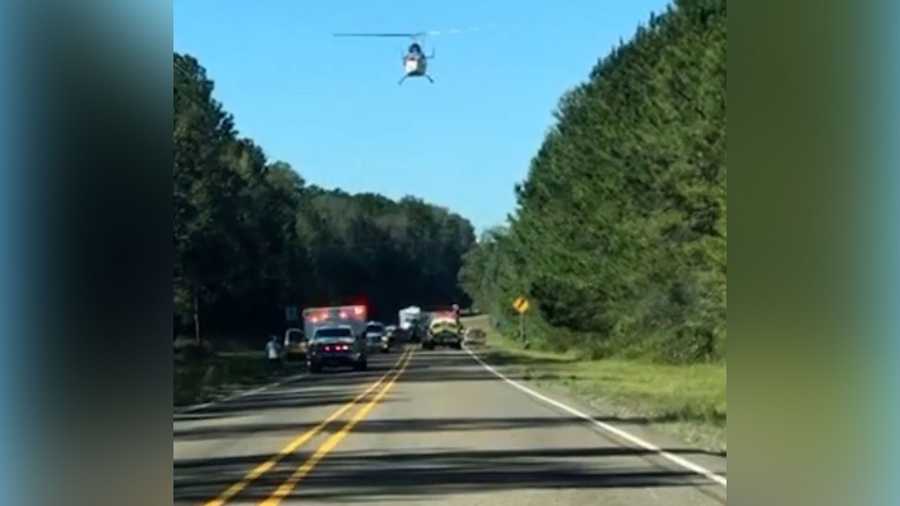 A medical helicopter arrives at the scene of a crash involving three bicyclists and an SUV on Farm-to-Market 787, about 3 miles east of Rye, Texas, on Oct. 30, 2021.