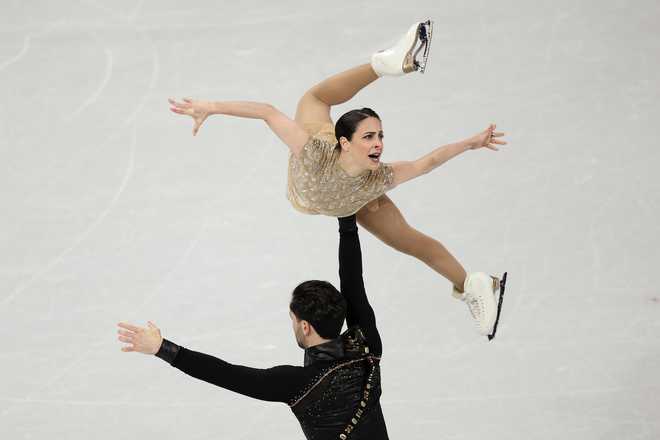 Deanna Stellato-Dudek and partner Maxime Deschamps of Team Canada compete in Pair Skating - Short Program on day nine of the Milano Cortina 2026 Winter Olympic Games at Milano Ice Skating Arena on Feb. 15, 2026, in Milan, Italy.