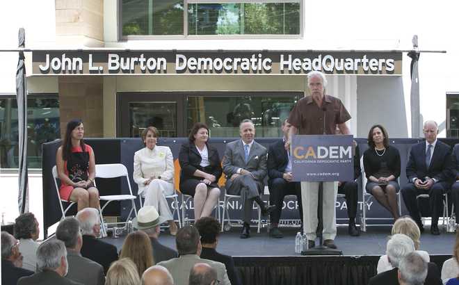 In&#x20;this&#x20;June&#x20;16,&#x20;2014,&#x20;file&#x20;photo.&#x20;then-California&#x20;Democratic&#x20;Party&#x20;Chairman&#x20;John&#x20;Burton&#x20;speaks&#x20;during&#x20;the&#x20;dedication&#x20;of&#x20;the&#x20;John&#x20;L.&#x20;Burton&#x20;California&#x20;Democratic&#x20;Party&#x20;Headquarters&#x20;in&#x20;Sacramento,&#x20;Calif.,&#x20;in&#x20;Sacramento,&#x20;Calif.&#x20;Two&#x20;California&#x20;men&#x20;have&#x20;been&#x20;charged&#x20;with&#x20;plotting&#x20;to&#x20;blow&#x20;up&#x20;the&#x20;state&#x20;Democratic&#x20;Party&#x27;s&#x20;headquarters&#x20;in&#x20;Sacramento,&#x20;a&#x20;bombing&#x20;they&#x20;hoped&#x20;would&#x20;be&#x20;the&#x20;first&#x20;in&#x20;a&#x20;series&#x20;of&#x20;politically-motivated&#x20;attacks,&#x20;federal&#x20;prosecutors&#x20;said&#x20;Thursday,&#x20;July&#x20;15,&#x20;2021.&#x20;From&#x20;left&#x20;are&#x20;then-House&#x20;Minority&#x20;Leader&#x20;Nancy&#x20;Pelosi,&#x20;then-Assembly&#x20;Speaker&#x20;Toni&#x20;Atkins,&#x20;then-state&#x20;Senate&#x20;President&#x20;Pro&#x20;Term&#x20;Darrell&#x20;Steinberg.&#x20;At&#x20;right&#x20;is&#x20;then-Gov.&#x20;Jerry&#x20;Brown&#x20;and&#x20;second&#x20;from&#x20;right&#x20;is&#x20;then-California&#x20;Attorney&#x20;General&#x20;Kamala&#x20;Harris.